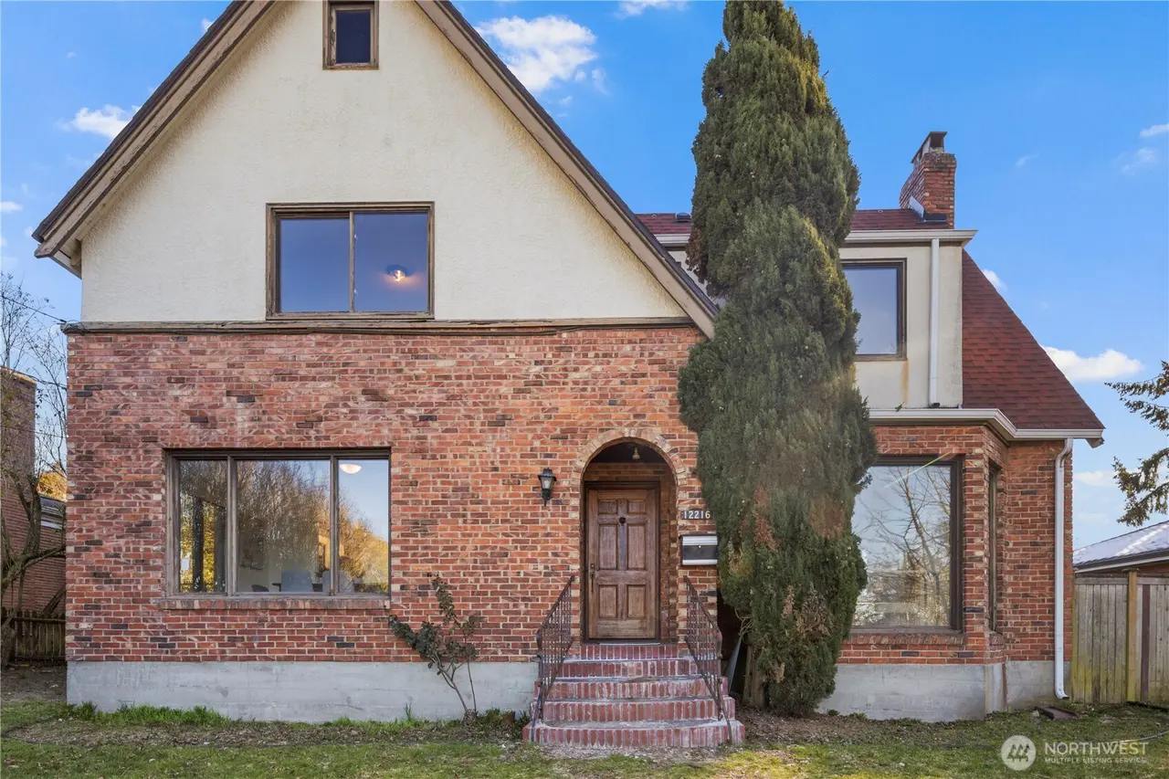 Seattle fix and flip investment opportunity - Historic Tudor style home Palatine Ave North Seattle before renovation showing exterior renovation potential